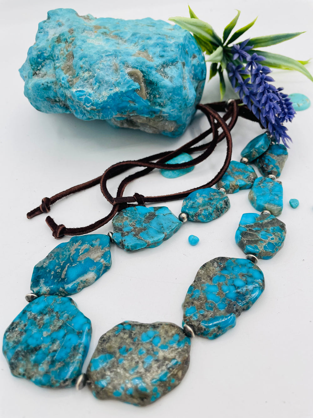 Beaded adjustable hatband that doubles as a necklace featuring Ithaca Peak turquoise and sterling silver Navajo pearl beads with deer lace in the back. Available only from Rockstar Cowgirl online or in store in Cody, Wyoming. 