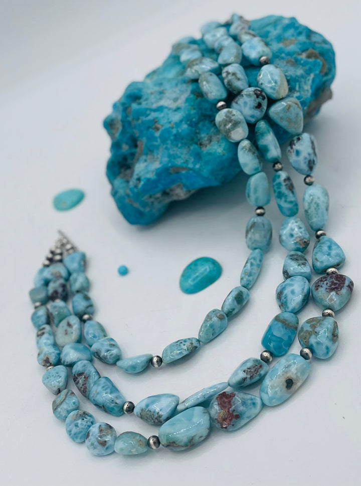 Beaded 3 strand necklace featuring smooth larimar nuggets and sterling silver beads. Available only from Rockstar Cowgirl online or in store in Cody, Wyoming.