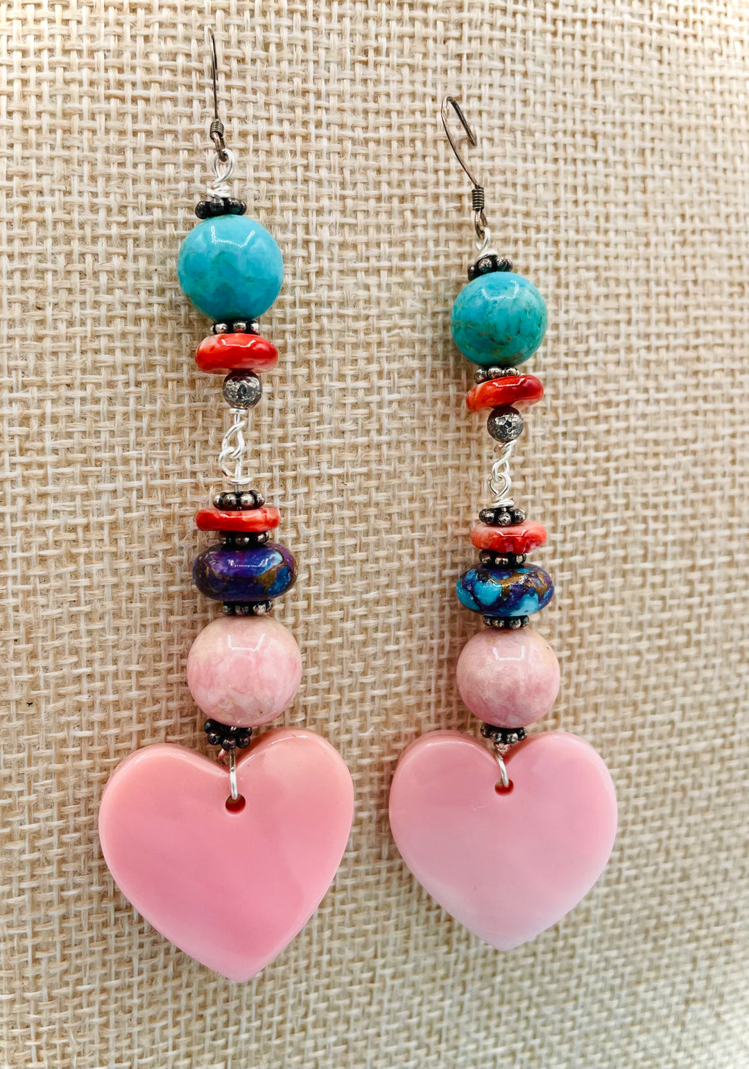 Handmade earrings featuring pink conch shell hearts, rhodochrosite, purple Mojave/ Mohave Kingman turquoise, and spiny oyster beads.  Available only from Rockstar Cowgirl online or in store in Cody, Wyoming.