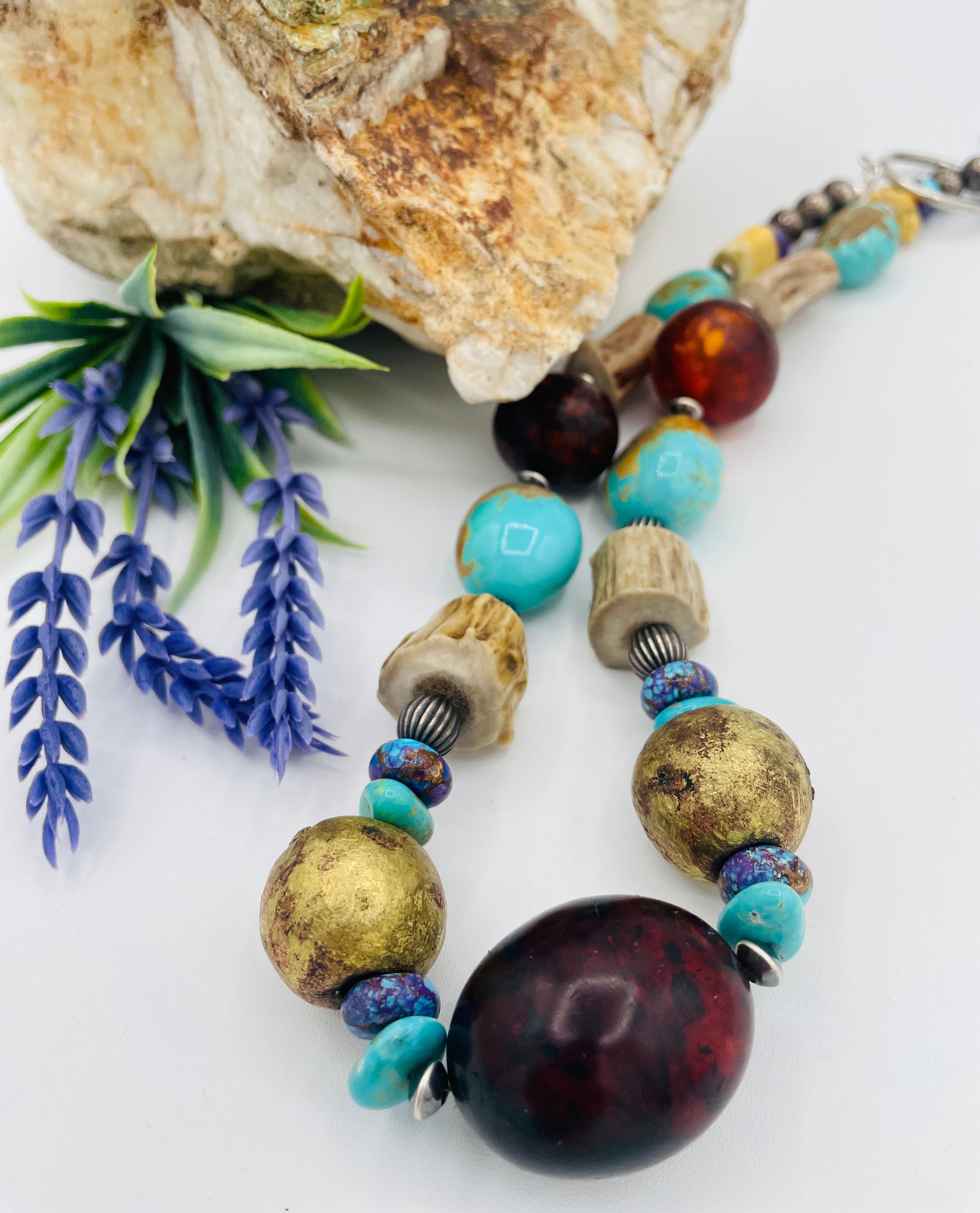 Chunky necklace featuring Baltic amber, Kingman turquoise, African bronze beads, large deer antler beads, and sterling silver Navajo pearl beads. Available only from Rockstar Cowgirl online or in store in Cody, Wyoming.