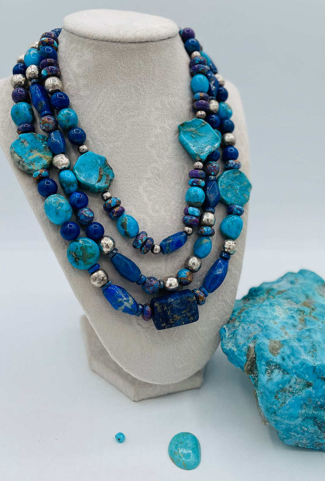 Chunky 3 strand beaded necklace featuring lapis, purple Mojave turquoise, sterling silver beads, Ithaca Peak turquoise, and Kingman turquoise. Available only from Rockstar Cowgirl online or in store in Cody, Wyoming.