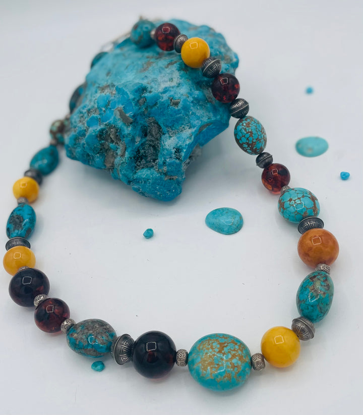 Beaded necklace featuring #8 turquoise, Ithaca Peak turquoise, Kingman turquoise, Baltic amber, and sterling silver beads. Available only from Rockstar Cowgirl online or in store in Cody, Wyoming. 