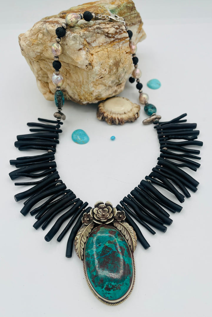 Beaded necklace featuring black coral sticks, smokey Kingman turquoise, sterling silver beads, lava, natural luster pearls, with a chrysocolla and Bali silver pendent. Available only from Rockstar Cowgirl online or in store in Cody, Wyoming.