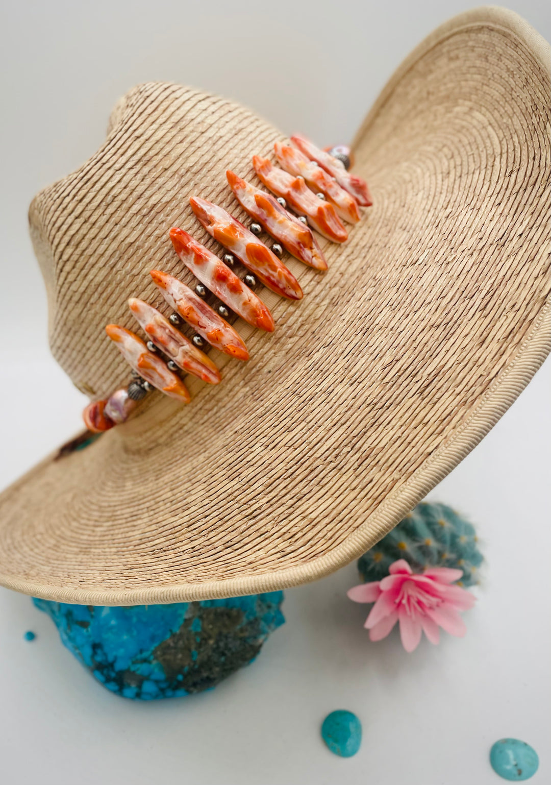 Adjustable beaded hatband featuring spiney oyster, natural luster flameball pearls, sterling silver beads, and finished with deer lace in the back. Available only from Rockstar Cowgirl online or in store in Cody, Wyoming.