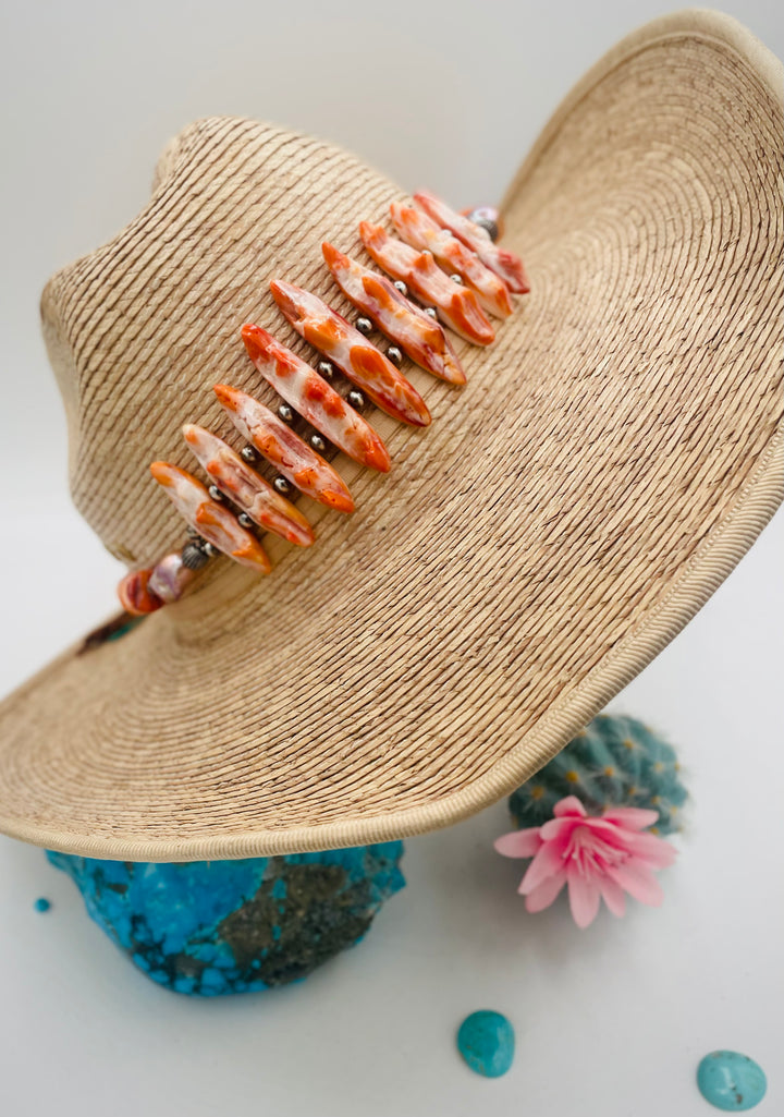 Adjustable beaded hatband featuring spiney oyster, natural luster flameball pearls, sterling silver beads, and finished with deer lace in the back. Available only from Rockstar Cowgirl online or in store in Cody, Wyoming.
