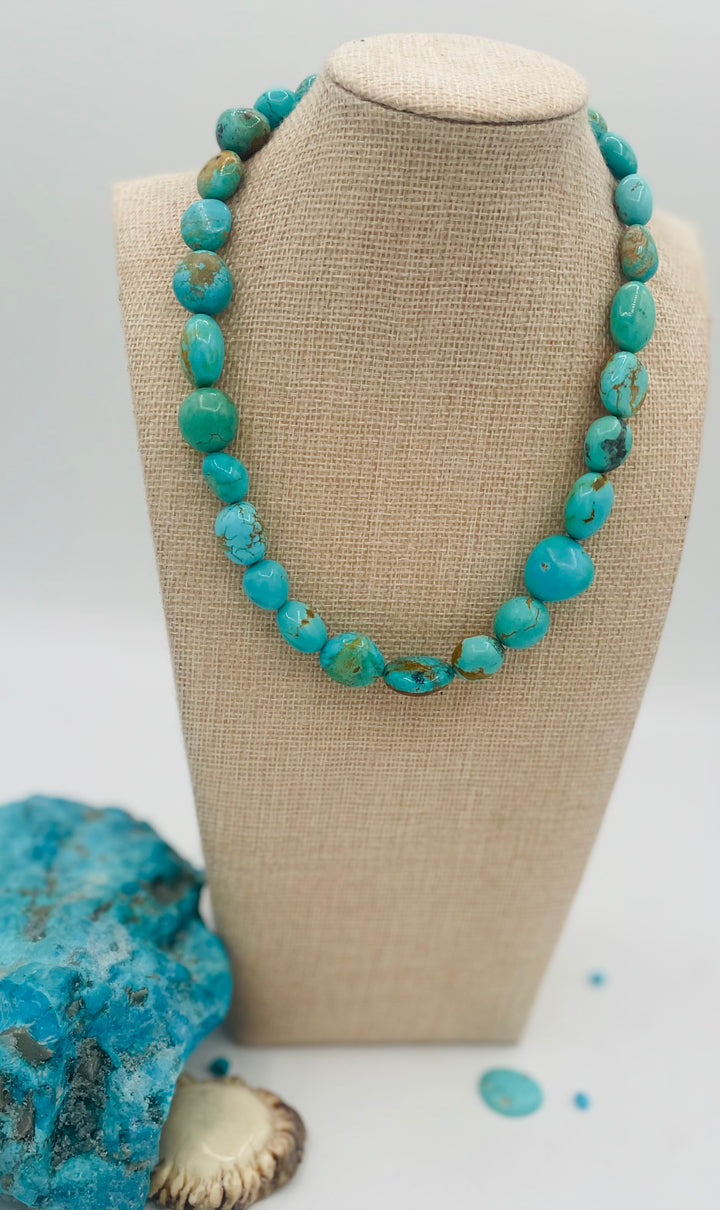 Graduated beaded necklace featuring Kingman turquoise with gold matrix in shades of blue and green. Available only from Rockstar Cowgirl online or in store in Cody, Wyoming.