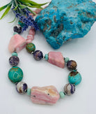 Chunky necklace featuring pink Peruvian opal nuggets, Kingman turquoise, cape amethyst, amazonite, and sterling silver Navajo pearl beads. Available only from Rockstar Cowgirl online or in store in Cody, Wyoming.