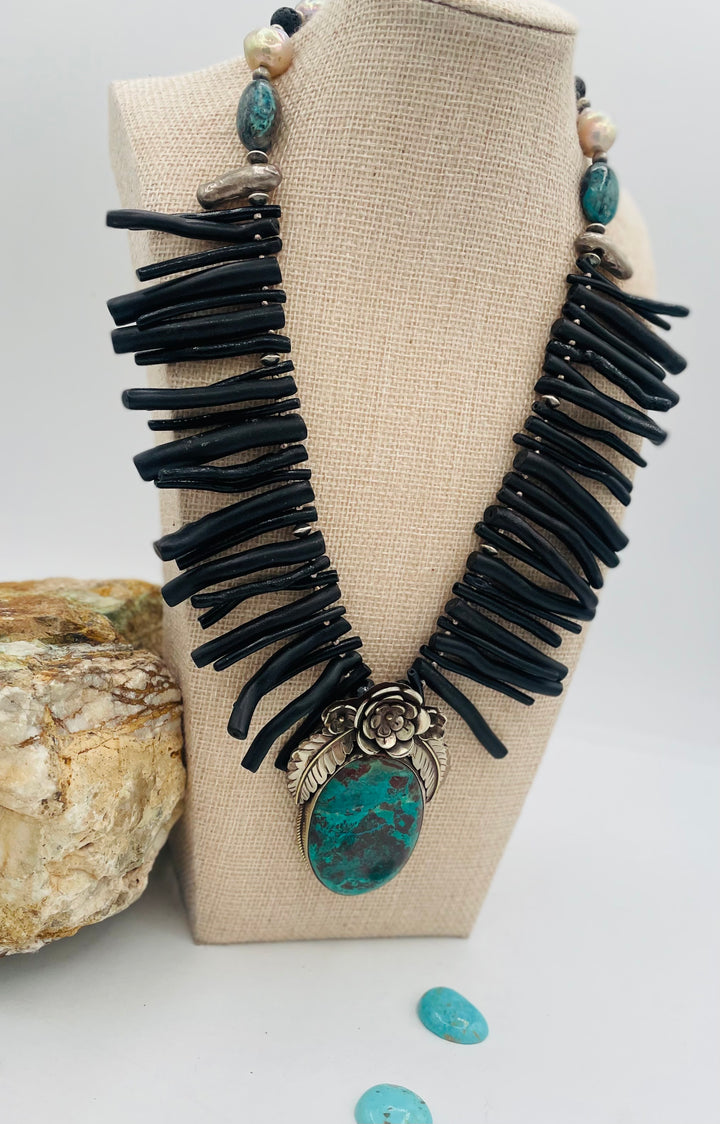 Beaded necklace featuring black coral sticks, smokey Kingman turquoise, sterling silver beads, lava, natural luster pearls, with a chrysocolla and Bali silver pendent. Available only from Rockstar Cowgirl online or in store in Cody, Wyoming.