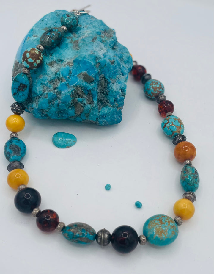 Beaded necklace featuring #8 turquoise, Ithaca Peak turquoise, Kingman turquoise, Baltic amber, and sterling silver beads. Available only from Rockstar Cowgirl online or in store in Cody, Wyoming. 