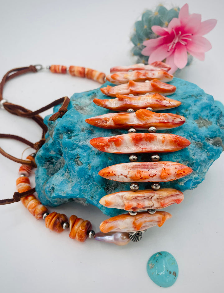 Adjustable beaded hatband featuring spiney oyster, natural luster flameball pearls, sterling silver beads, and finished with deer lace in the back. Available only from Rockstar Cowgirl online or in store in Cody, Wyoming.