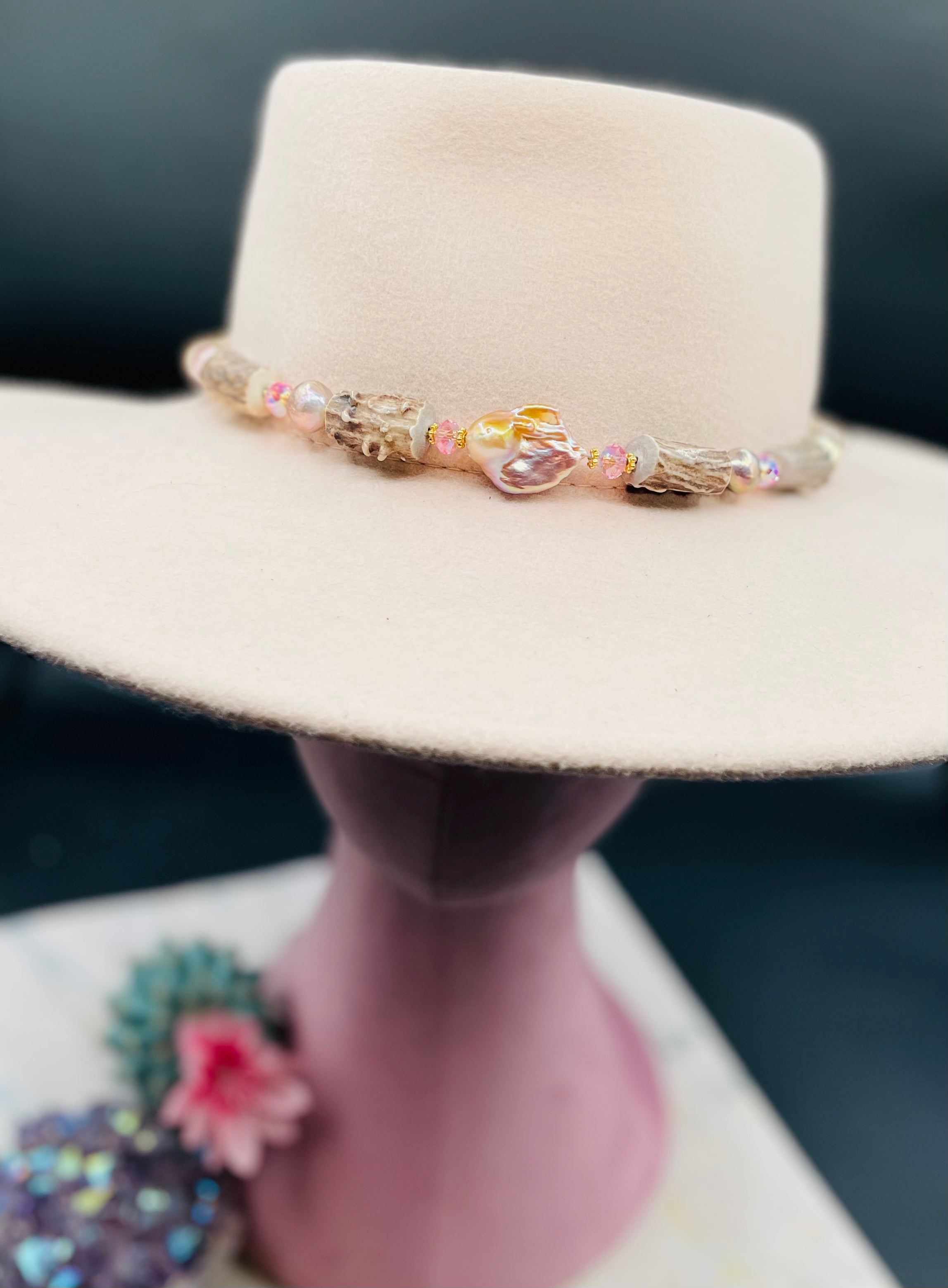 Baroque natural luster pearl, knobby deer antlers beads and vintage Swarovski crystal hatband. Finished with Deer lace and slide bead for adjustability. Available only from Rockstar Cowgirl online or in store in Cody, Wyoming.