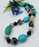 Chunky necklace featuring Kingman turquoise, cape amethyst, deer antler beads, and various sterling silver beads. Available only from Rockstar Cowgirl online or in store in Cody, Wyoming.
