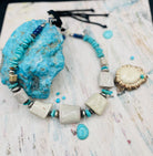 Beaded hatband with giant elk antler beads, Campitos turquoise, lapis, sterling silver, and Bali silver beads finished with leather lace and slide bead for fit. Available only from Rockstar Cowgirl online or in store in Cody, Wyoming.