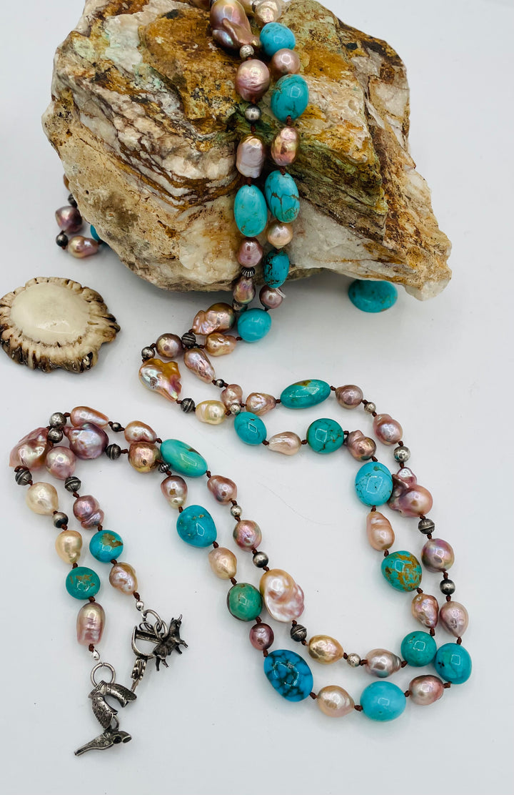 Silk knotted lariat necklace featuring baroque natural luster pearls, Kingman turquoise nuggets, and sterling silver beads. Available only from Rockstar Cowgirl online or in store in Cody, Wyoming.