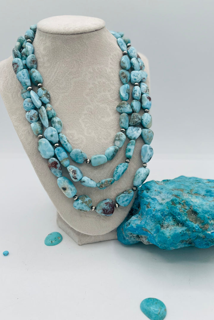 Beaded 3 strand necklace featuring smooth larimar nuggets and sterling silver beads. Available only from Rockstar Cowgirl online or in store in Cody, Wyoming.