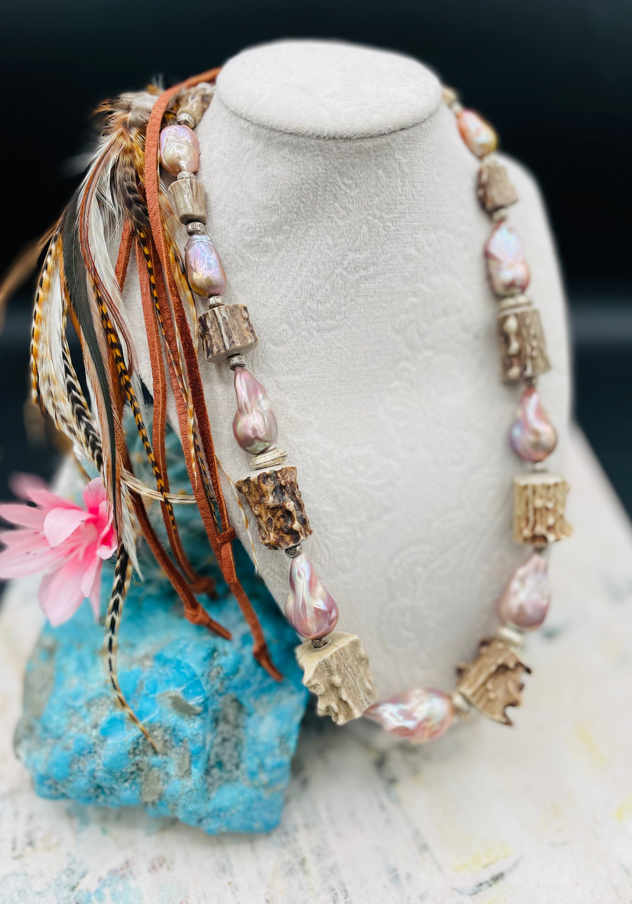 Hatband or necklace with giant baroque natural luster pearls, knobby deer antler beads, and  sterling silver beads and finished with feathers, deer lace, and a slide bead. Available only from Rockstar Cowgirl online or in store in Cody, Wyoming.