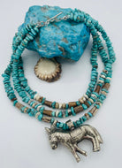 3 strand necklace featuring Campitos turquoise, chrysoprase, and deer antler beads with a donkey pendent. Available only from Rockstar Cowgirl online or in store in Cody, Wyoming.