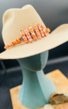 Hatband or necklace featuring several shapes of spiny oyster beads and copper accents. Finished with deer lace each with a charm and a slide bead for fit. Available only from Rockstar Cowgirl online or in store in Cody, Wyoming.