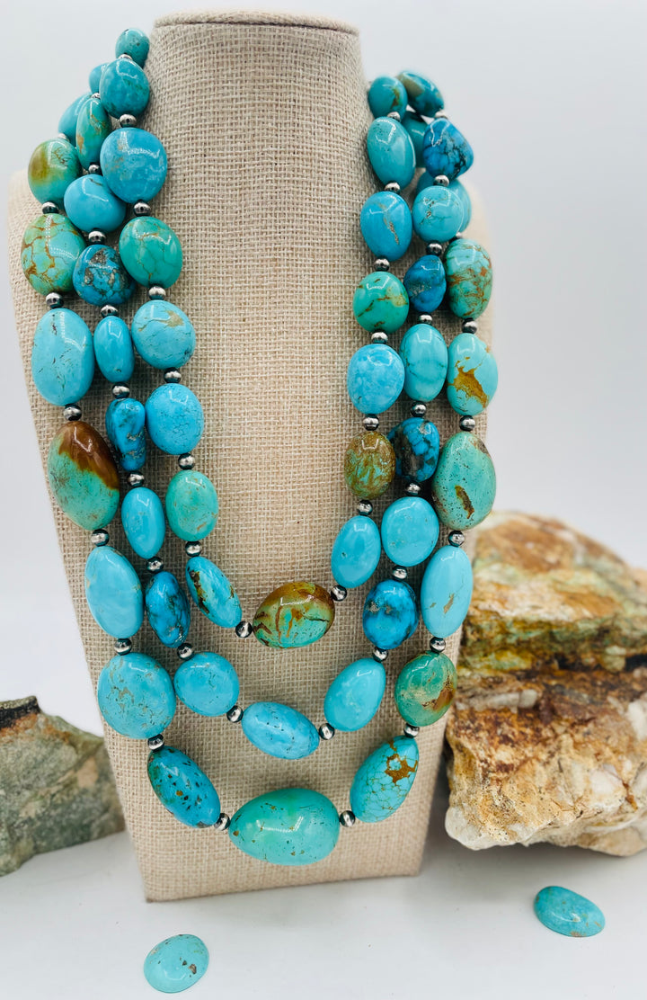 3 strand beaded necklace featuring Kingman turquoise in blues and greens with sterling silver Navajo pearl beads. Available only from Rockstar Cowgirl online or in store in Cody, Wyoming.