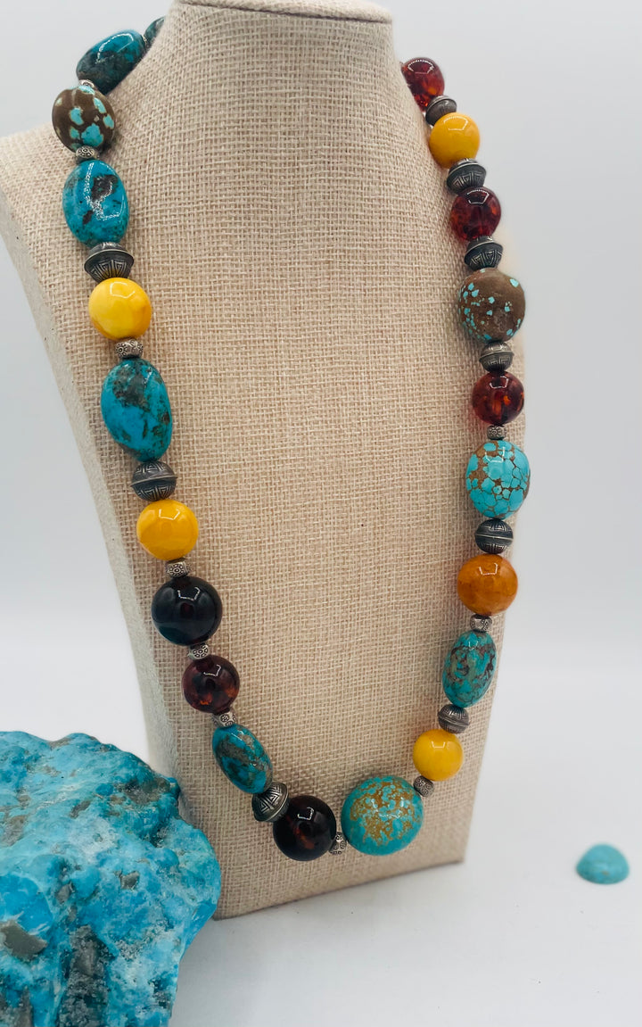 Beaded necklace featuring #8 turquoise, Ithaca Peak turquoise, Kingman turquoise, Baltic amber, and sterling silver beads. Available only from Rockstar Cowgirl online or in store in Cody, Wyoming. 