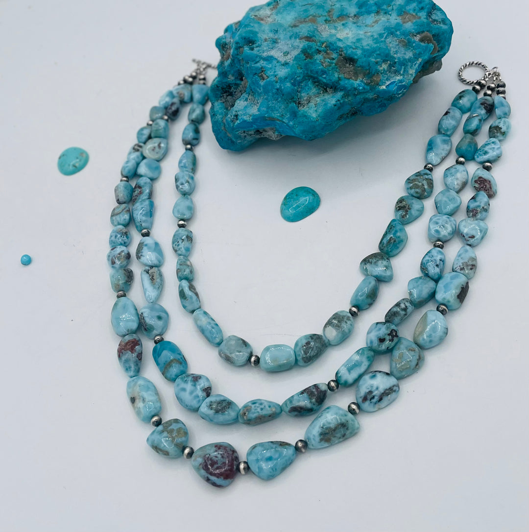 Beaded 3 strand necklace featuring smooth larimar nuggets and sterling silver beads. Available only from Rockstar Cowgirl online or in store in Cody, Wyoming.