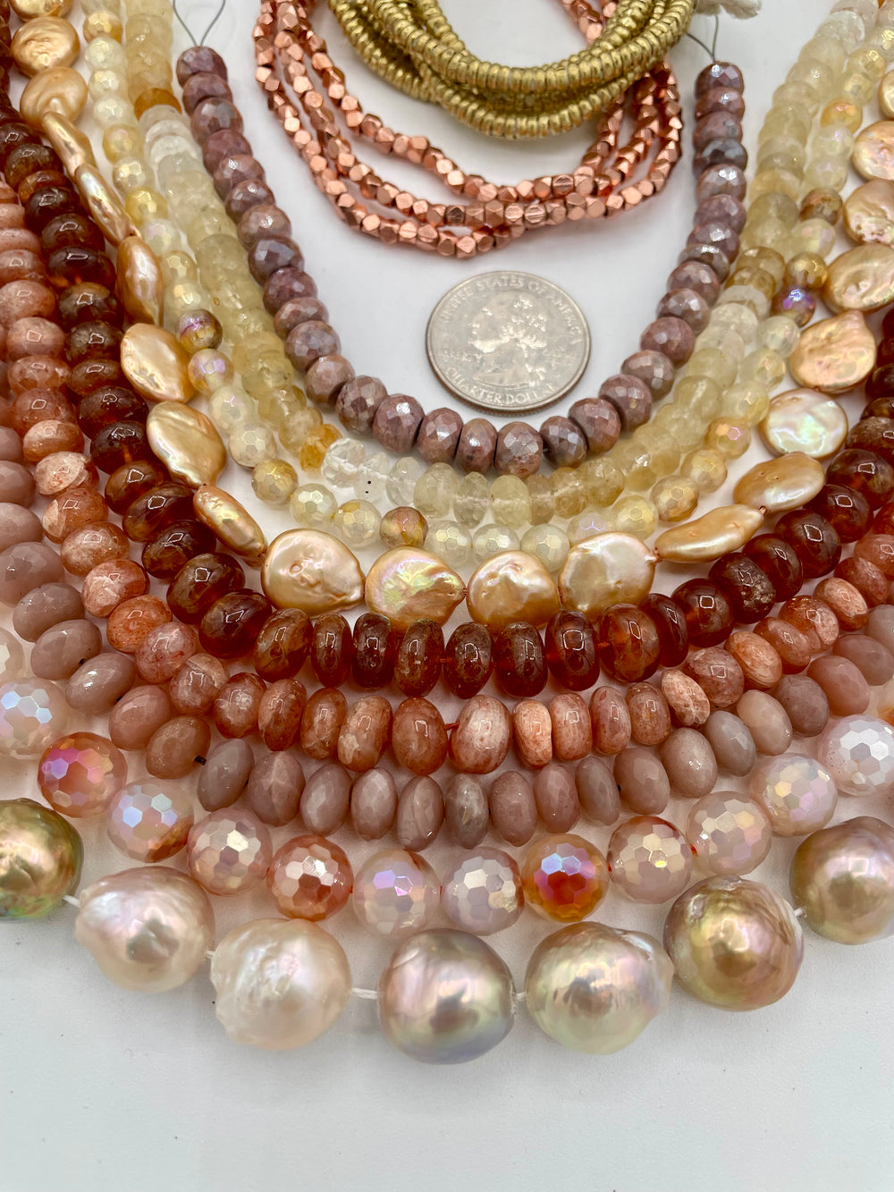 The Sun and Moon bead box features strands of Edison pearls, plated agate, brown moonstone, sunstone, hessonite garnet, coin pearls, citrine, brown silverite, with copper and brass spacer beads. Available only from Rockstar Cowgirl online or in store in Cody, Wyoming.