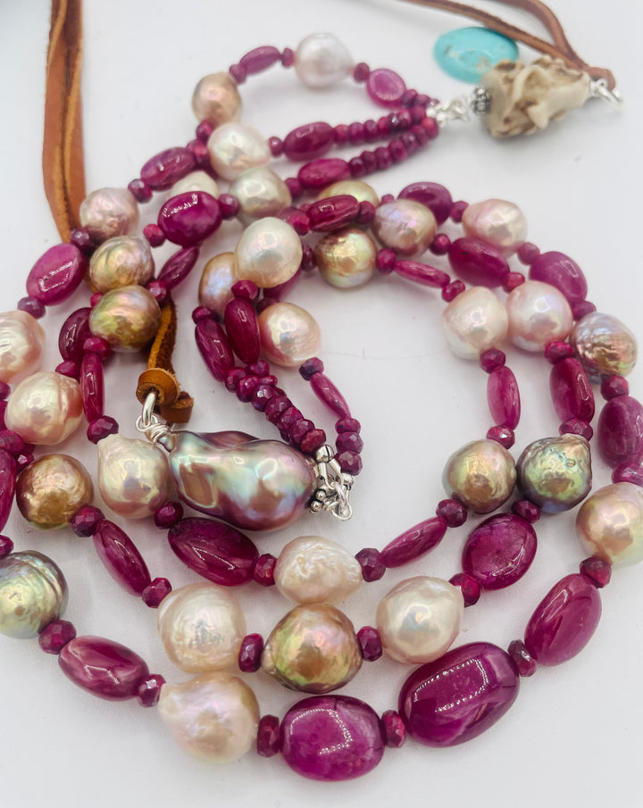 Adjustable 3 strand necklace featuring ruby, Edison pearls, flameball baroque pearl, textured deer antler bead, and finished with deer lace. Available only from Rockstar Cowgirl online or in store in Cody, Wyoming.