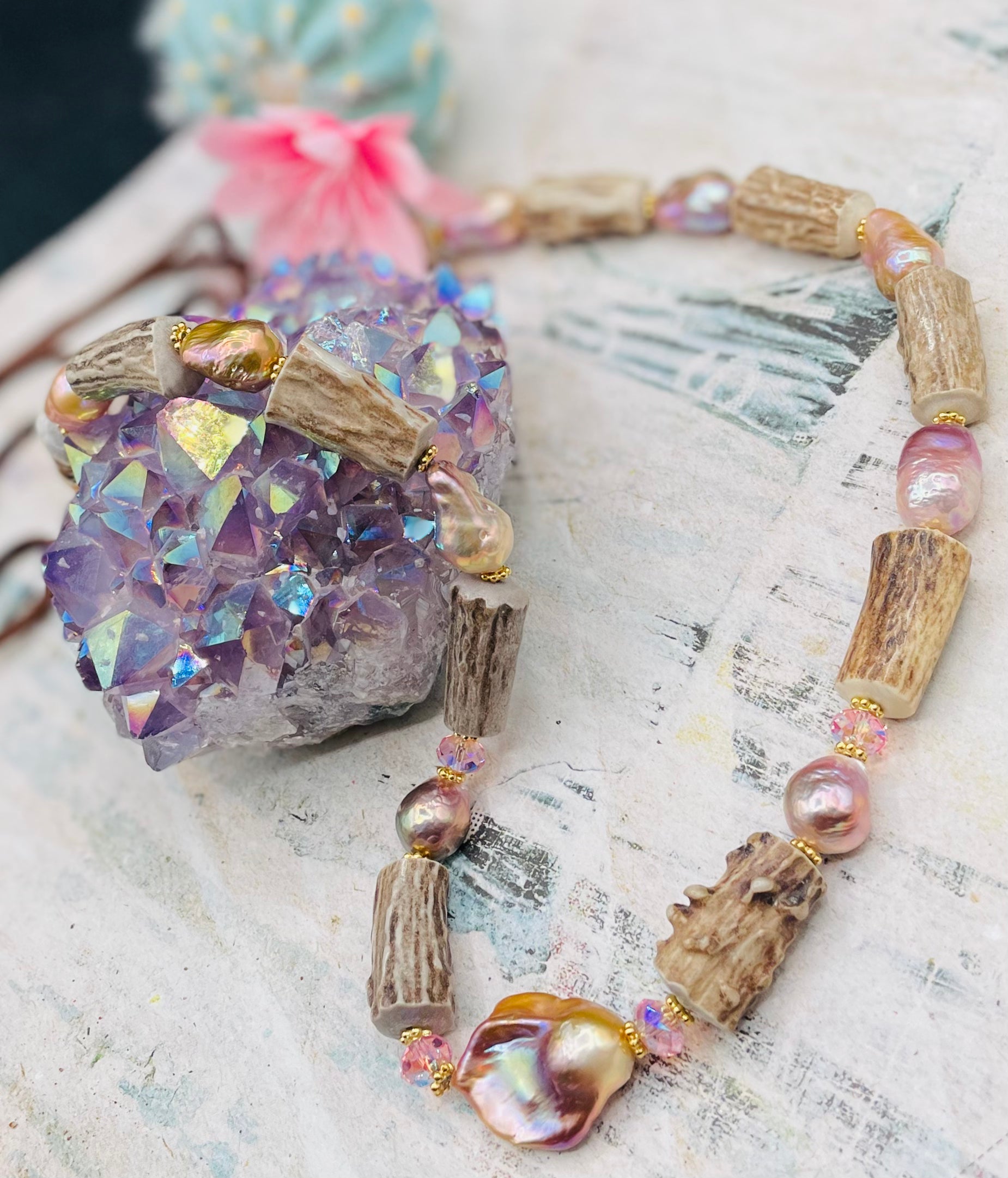 Baroque natural luster pearl, knobby deer antlers beads and vintage Swarovski crystal hatband. Finished with Deer lace and slide bead for adjustability. Available only from Rockstar Cowgirl online or in store in Cody, Wyoming.