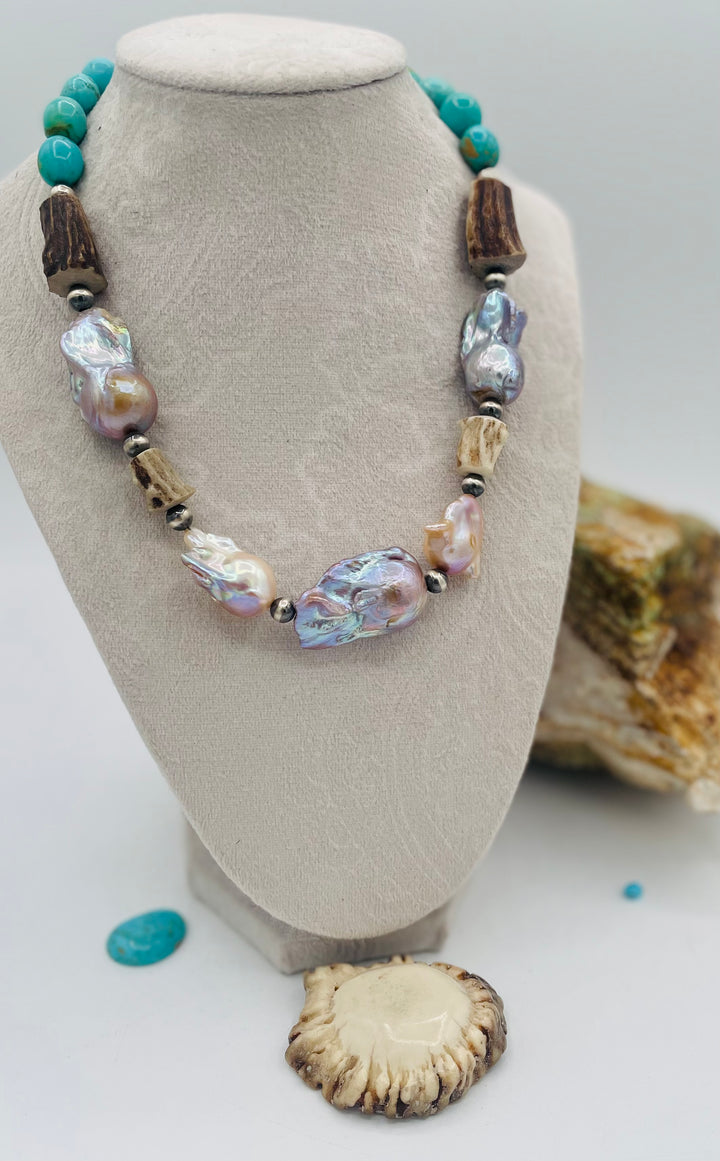 Beaded necklace featuring Flame ball natural luster baroque pearls, deer antler, Kingman turquoise nuggets, and sterling silver beads. Available only from Rockstar Cowgirl online or in store in Cody, Wyoming.