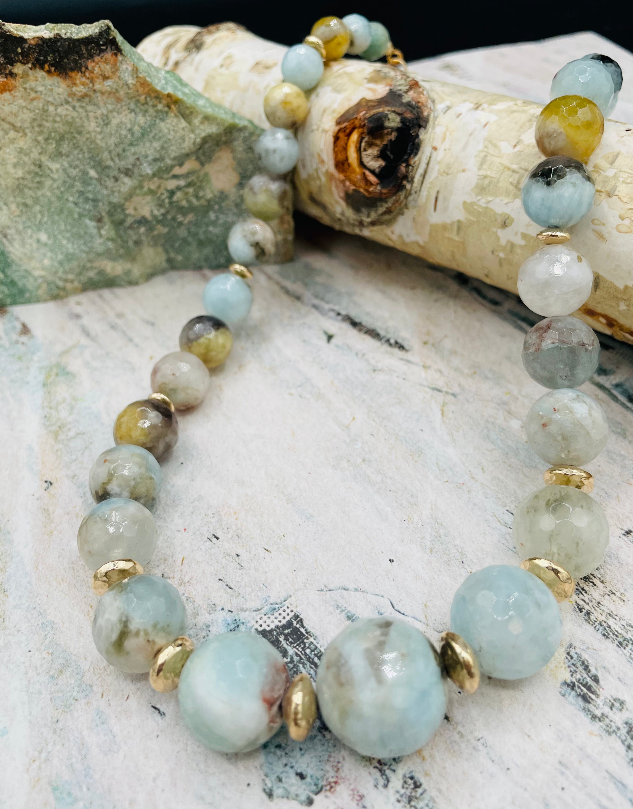 Aquamarine graduated round beaded necklace with hammered 14k gold beads sprinkled throughout. Available only from Rockstar Cowgirl online or in store in Cody, Wyoming.