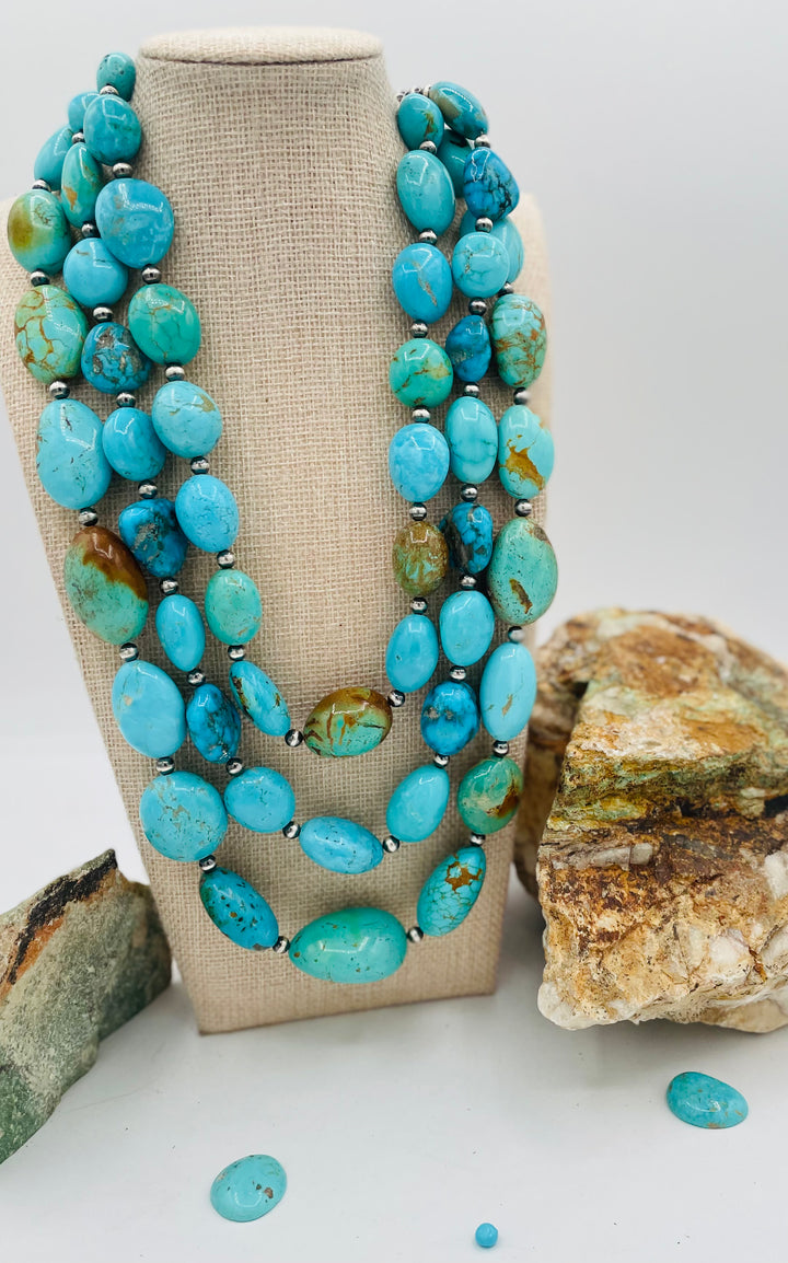 3 strand beaded necklace featuring Kingman turquoise in blues and greens with sterling silver Navajo pearl beads. Available only from Rockstar Cowgirl online or in store in Cody, Wyoming.