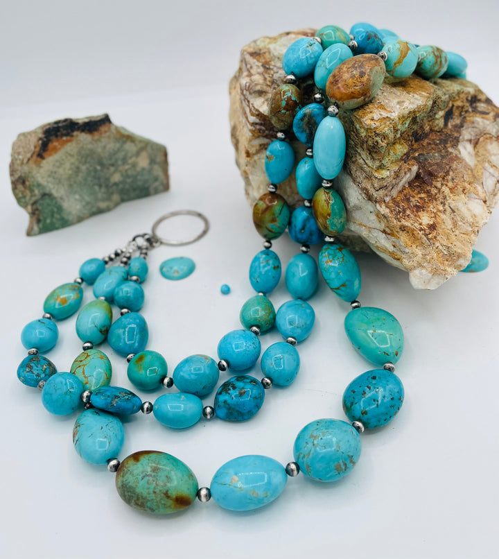 3 strand beaded necklace featuring Kingman turquoise in blues and greens with sterling silver Navajo pearl beads. Available only from Rockstar Cowgirl online or in store in Cody, Wyoming.