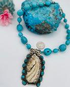 Necklace featuring Kingman turquoise nuggets, sterling silver beads, and carved bone pendent. Available only from Rockstar Cowgirl online or in store in Cody, Wyoming.