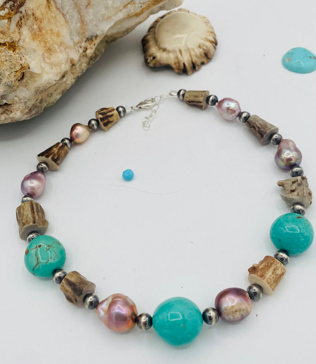 Beaded necklace featuring Kingman turquoise, natural luster pearls, deer antler, and sterling silver beads. Available only from Rockstar Cowgirl online or in store in Cody, Wyoming.