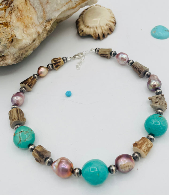 Beaded necklace featuring Kingman turquoise, natural luster pearls, deer antler, and sterling silver beads. Available only from Rockstar Cowgirl online or in store in Cody, Wyoming.