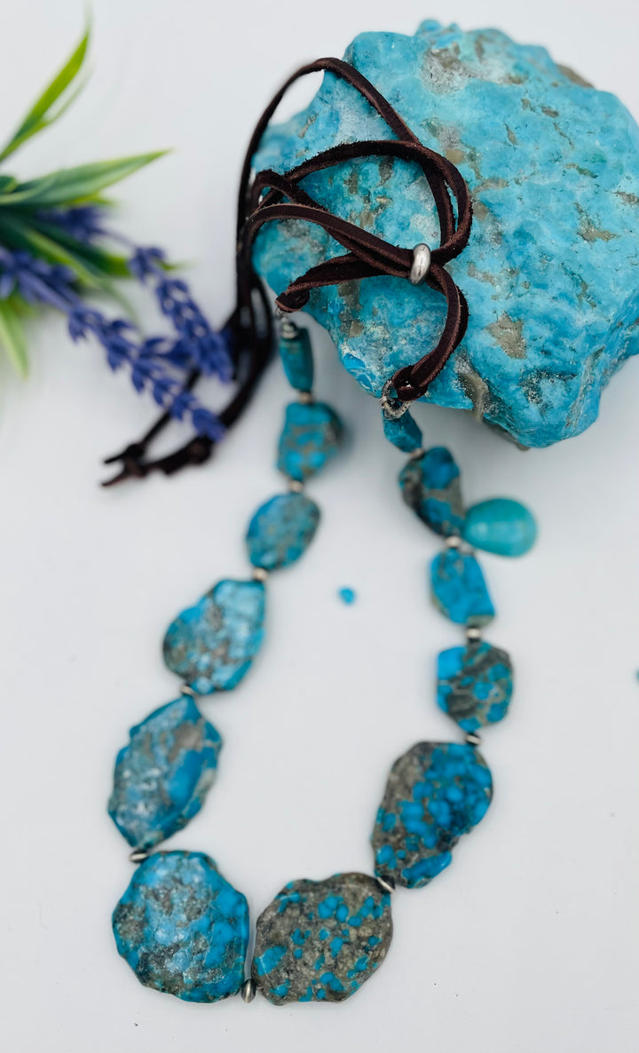 Beaded adjustable hatband that doubles as a necklace featuring Ithaca Peak turquoise and sterling silver Navajo pearl beads with deer lace in the back. Available only from Rockstar Cowgirl online or in store in Cody, Wyoming. 