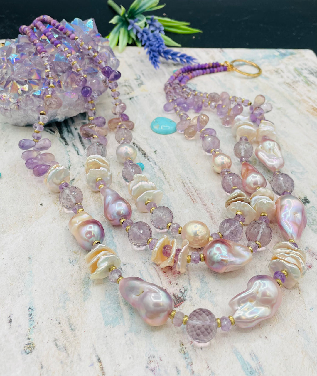 Decadent 3 strand necklace set with matching earrings. Featuring giant flameball natural luster pearls, giant Edison natural luster pearls, pearl discs, pink amethyst, ametrine, and phosphosiderite. Available only from Rockstar Cowgirl online or in store in Cody, Wyoming.