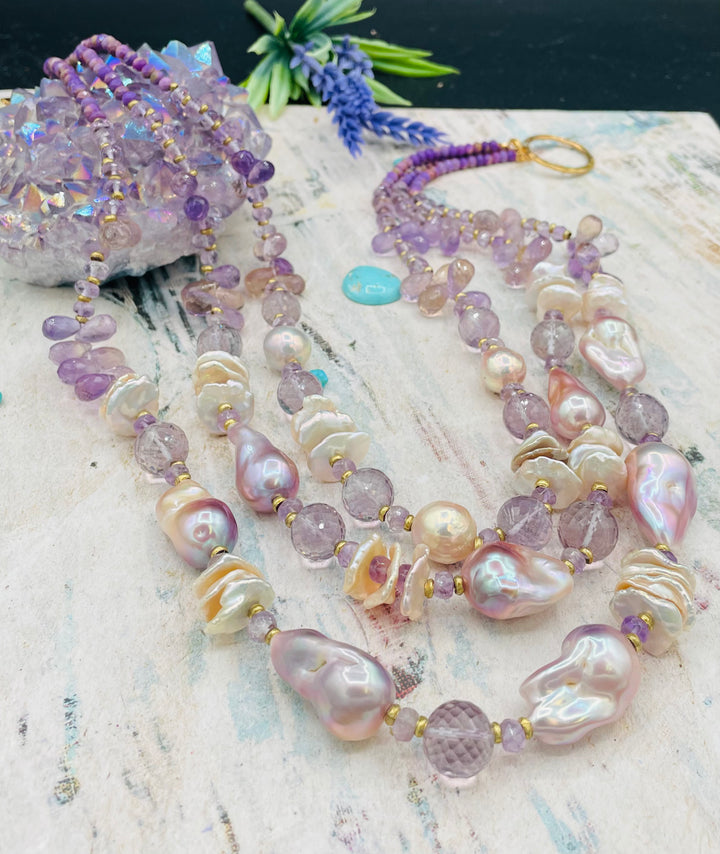 Decadent 3 strand necklace set with matching earrings. Featuring giant flameball natural luster pearls, giant Edison natural luster pearls, pearl discs, pink amethyst, ametrine, and phosphosiderite. Available only from Rockstar Cowgirl online or in store in Cody, Wyoming.