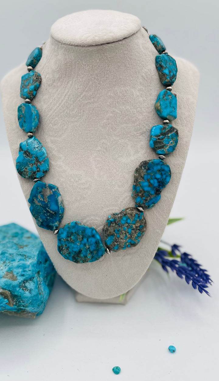 Beaded adjustable hatband that doubles as a necklace featuring Ithaca Peak turquoise and sterling silver Navajo pearl beads with deer lace in the back. Available only from Rockstar Cowgirl online or in store in Cody, Wyoming. 