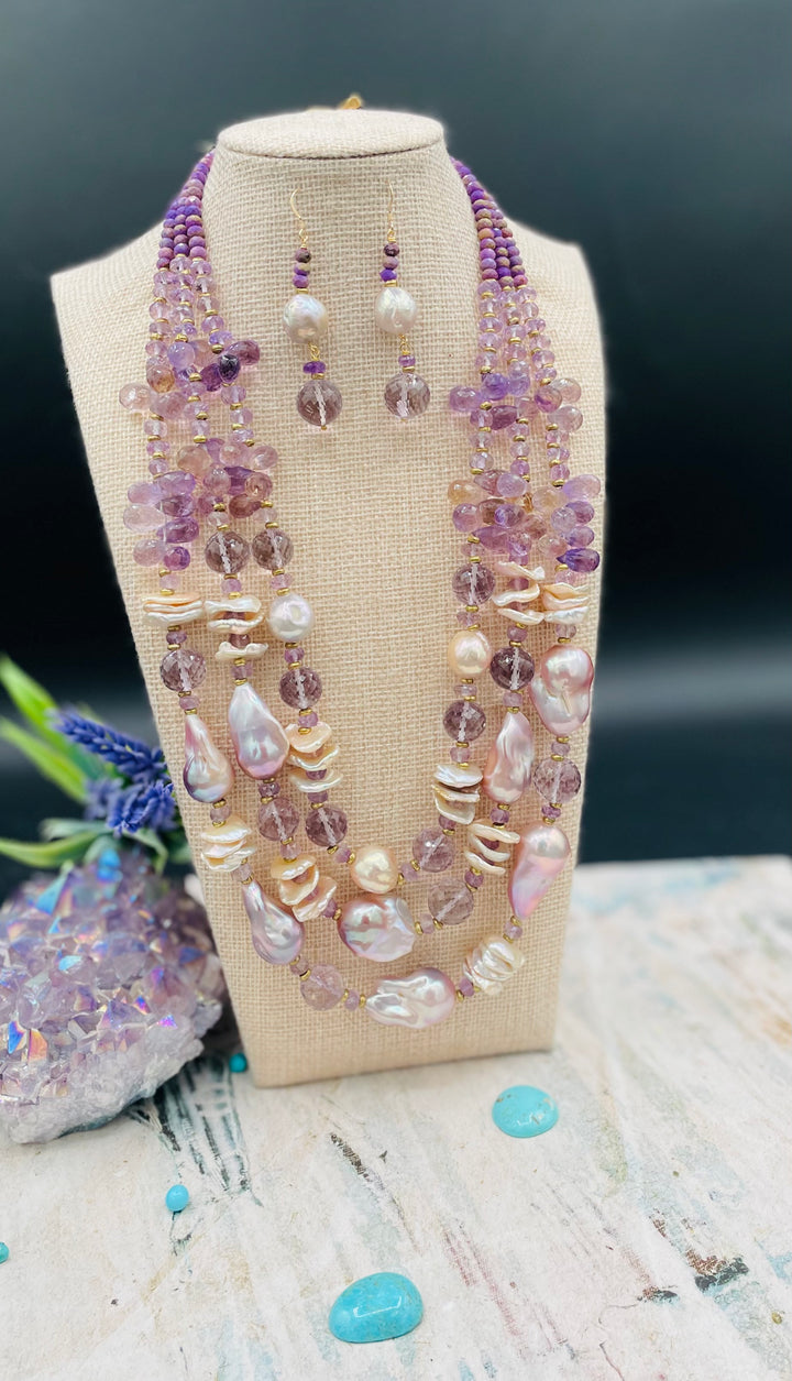 Decadent 3 strand necklace set with matching earrings. Featuring giant flameball natural luster pearls, giant Edison natural luster pearls, pearl discs, pink amethyst, ametrine, and phosphosiderite. Available only from Rockstar Cowgirl online or in store in Cody, Wyoming.