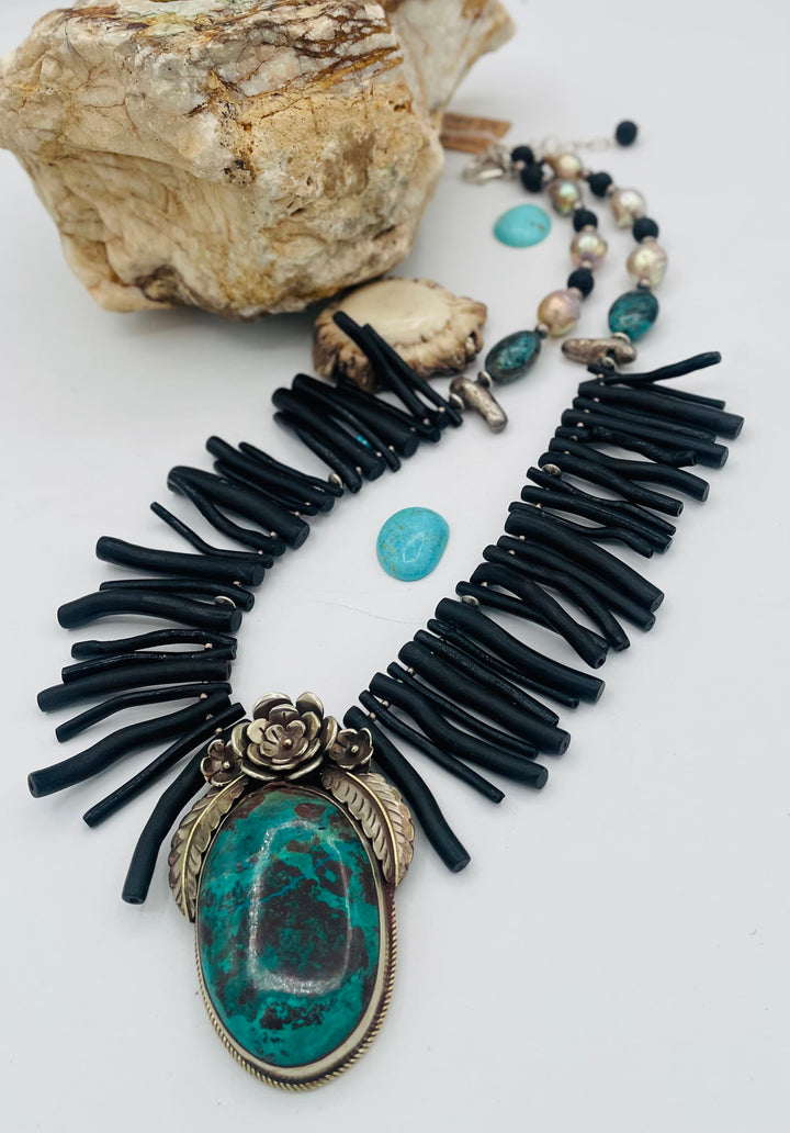Beaded necklace featuring black coral sticks, smokey Kingman turquoise, sterling silver beads, lava, natural luster pearls, with a chrysocolla and Bali silver pendent. Available only from Rockstar Cowgirl online or in store in Cody, Wyoming.