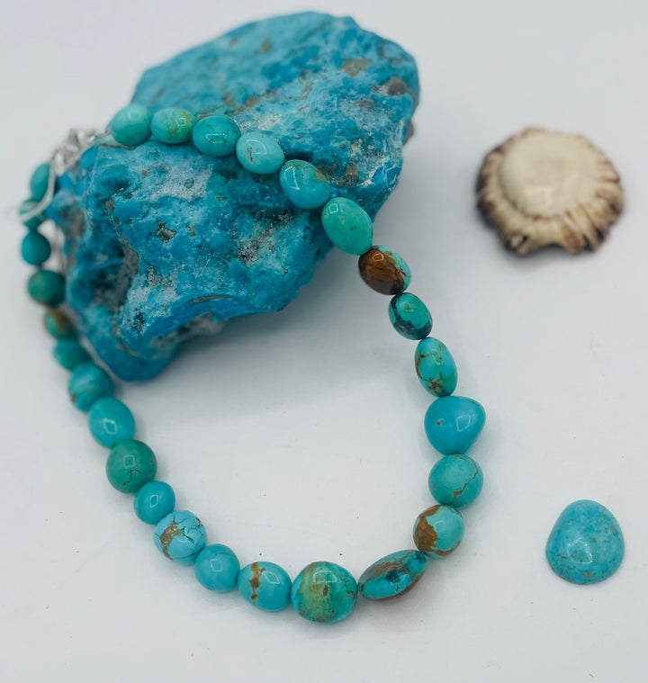 Graduated beaded necklace featuring Kingman turquoise with gold matrix in shades of blue and green. Available only from Rockstar Cowgirl online or in store in Cody, Wyoming.
