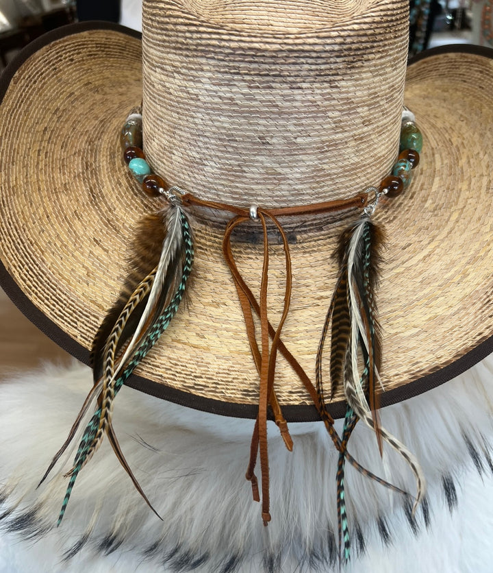 The back of the hatband highlighting the feathers, deer lace, and sliding bead. Available only from Rockstar Cowgirl online or in store in Cody, Wyoming.