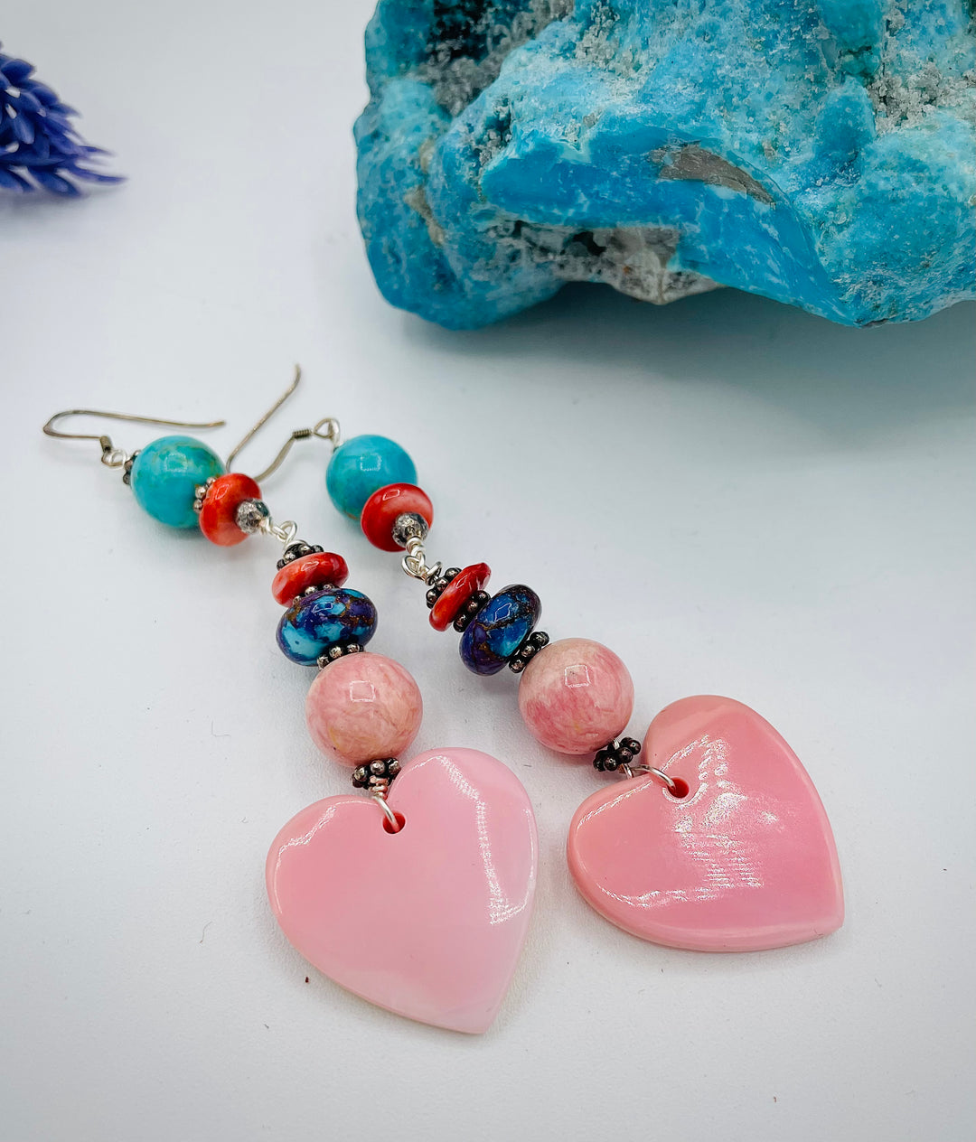 Handmade earrings featuring pink conch shell hearts, rhodochrosite, purple Mojave/ Mohave Kingman turquoise, and spiny oyster beads.  Available only from Rockstar Cowgirl online or in store in Cody, Wyoming.