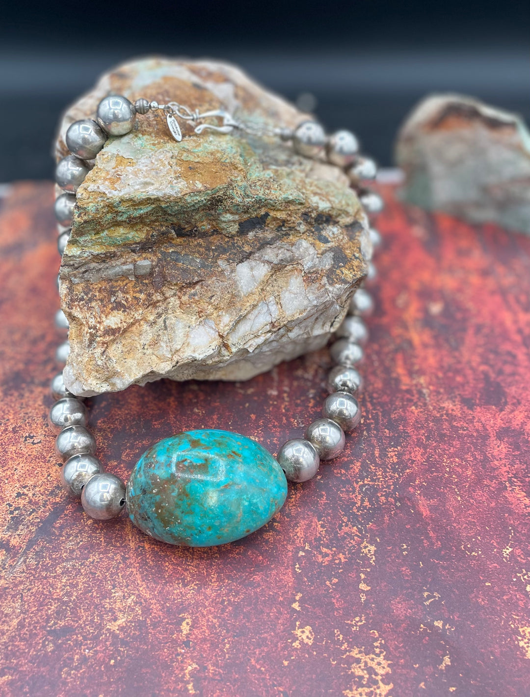 A close up highlighting the matrix in the extra large Kingman turquoise nugget in this necklace. Available only from Rockstar Cowgirl online or in store in Cody, Wyoming