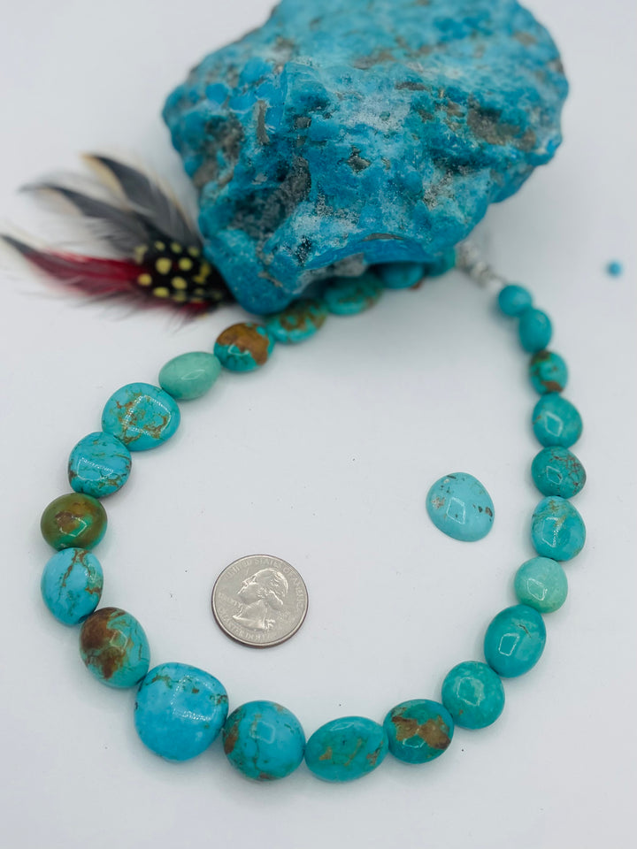 Graduated beaded necklace featuring Kingman turquoise with gold matrix in shades of blue and green. U.S. quarter for size reference. Available only from Rockstar Cowgirl online or in store in Cody, Wyoming.