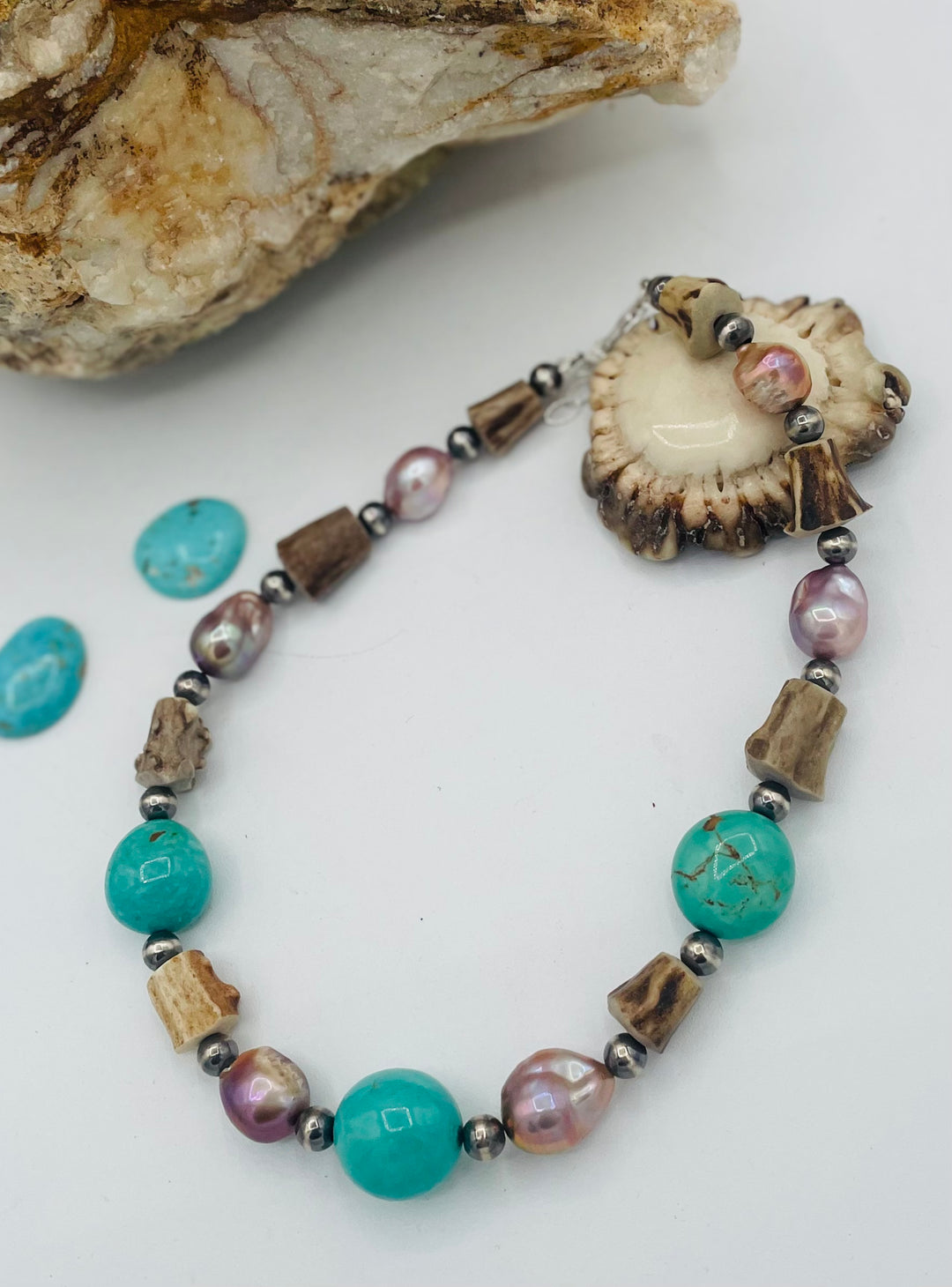 Beaded necklace featuring Kingman turquoise, natural luster pearls, deer antler, and sterling silver beads. Available only from Rockstar Cowgirl online or in store in Cody, Wyoming.