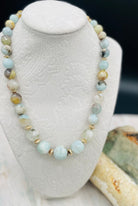 Aquamarine graduated round beaded necklace with hammered 14k gold beads sprinkled throughout. Available only from Rockstar Cowgirl online or in store in Cody, Wyoming.