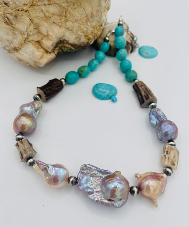 Beaded necklace featuring Flame ball natural luster baroque pearls, deer antler, Kingman turquoise nuggets, and sterling silver beads. Available only from Rockstar Cowgirl online or in store in Cody, Wyoming.