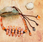 Hatband or necklace featuring several shapes of spiny oyster beads and copper accents. Finished with deer lace each with a charm and a slide bead for fit. Available only from Rockstar Cowgirl online or in store in Cody, Wyoming.